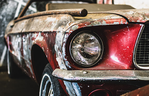 A rusty junk car we can haul away.